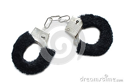 Handcuffs with fur on white background. Accessory for love games. black. Stock Photo