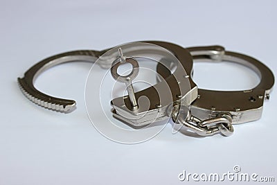 Handcuffs with key Stock Photo
