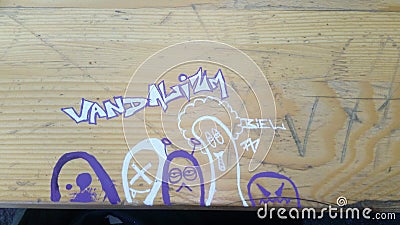 Handdrawn graffiti Art on wooden Table Stock Photo