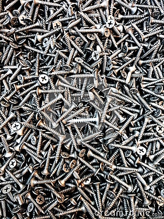 A handful of bronze screws Stock Photo