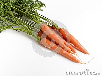 A handful of carrots with their respective branches and leaves Stock Photo