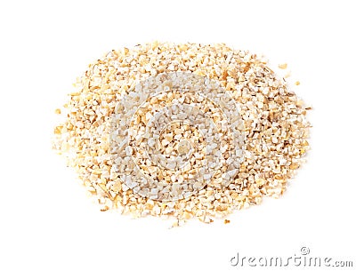 Handful of crushed pot barley groats on white Stock Photo
