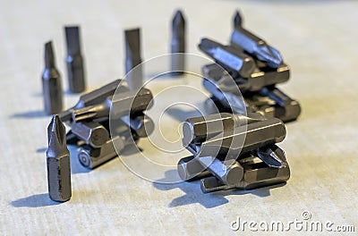 A handful of different metal screwdriver heads Stock Photo
