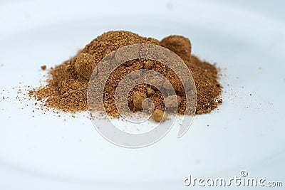 Handful of fish meal on the white surface Stock Photo