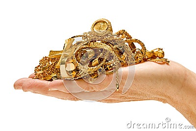 Hand holding gold jewelry Stock Photo