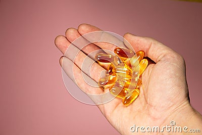 handful of Omega-3 capsules. Vitamins. Healthy lifestyle Stock Photo