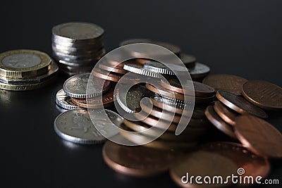 Coins on tabletop Stock Photo