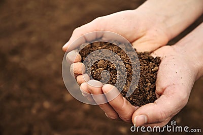 Handful of Rich Brown Soil Stock Photo