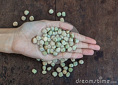 Handful of rich sugar pea seed Stock Photo