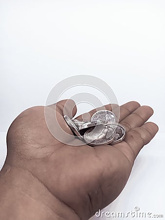 a handful of silver Indonesian coins Stock Photo