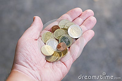 Handful of small loose pocket change euro cent coins in palm of hand Stock Photo
