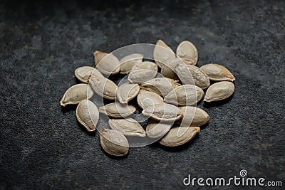A handful of uncooked pumpkin seeds Stock Photo