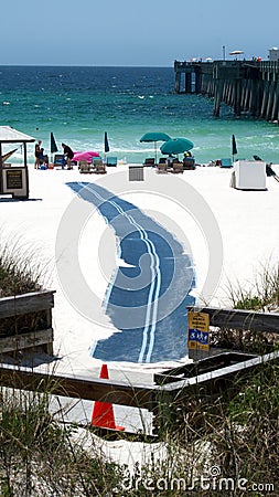 Handicap access mat by a pier on the beach Editorial Stock Photo