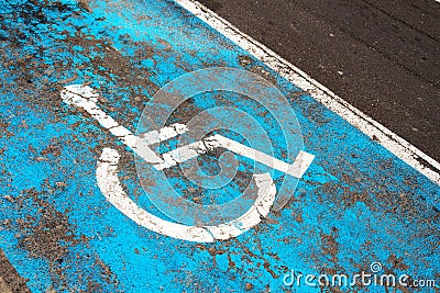 Handicap parking sign painted on road on parking space for disabled or handicapped people Stock Photo