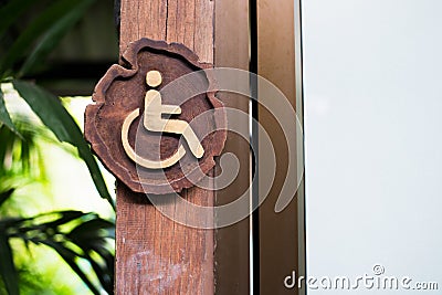 Handicapped accessible sign made from wood Stock Photo