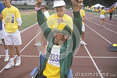 Handicapped Athlete cheering at finish line, Special Olympics, UCLA, CA Editorial Stock Photo