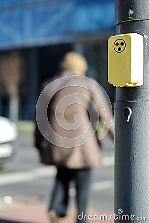 Handicapped person crossing road Stock Photo