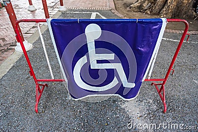 Handicapped wheelchair symbol on parking space Stock Photo