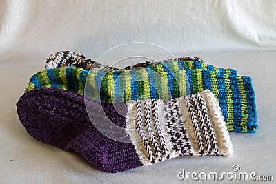 Handicraft concept, colorful knitted socks, knitting as a hobby Stock Photo