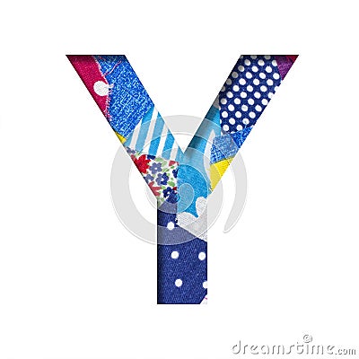 Handicraft or creative font. The letter Y cut out of paper on the background of the texture of pieces of colored fabrics for home Stock Photo