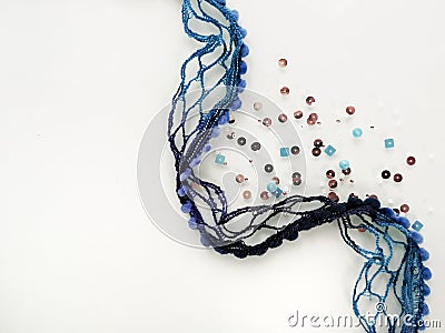 Handicraft materials. Decorative blue thread and beads. Creative background Stock Photo