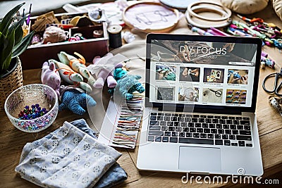 Handiwork objects laptop on the table Stock Photo