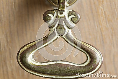 Handle of a drawer of an oak furniture. Stock Photo