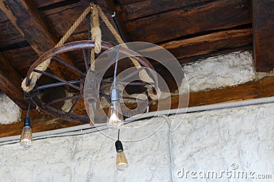 Handmade abstract chandelier under the wooden ceiling Stock Photo