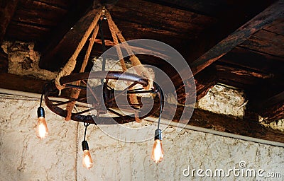 Handmade abstract chandelier under the wooden ceiling Stock Photo