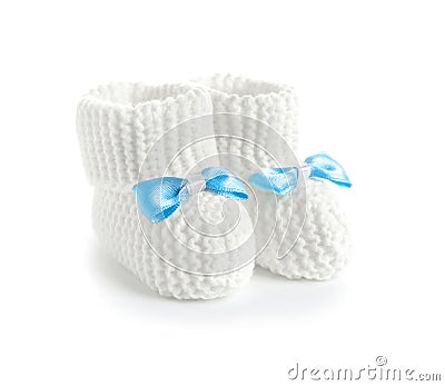 Handmade baby booties with bows on white Stock Photo