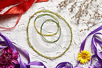 Handmade beadwork, beading as a hobby. background of various flowers and plants Stock Photo