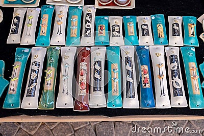 Handmade ceramic painted cases for mezuzah sold at handicraft market. Tel-Aviv Stock Photo