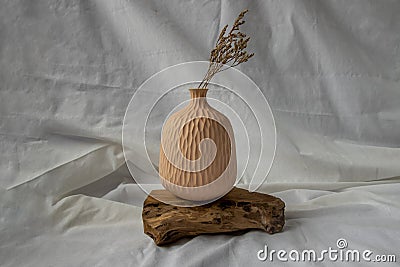 Handmade Ceramic Vases and Dried flowers on wooden logs Stock Photo