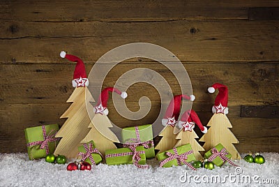 Handmade christmas trees carved and apple green christmas presen Stock Photo