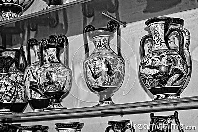 Handmade clay dishes in the Greek style in the shop at the potter`s workshop Editorial Stock Photo