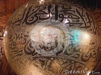 Shining Arabic copper lantern in khan el khalili souq with Quran arabic handwriting engraved on it Stock Photo