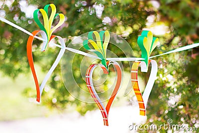 Handmade craft project. Creative DIY concept carrots garland for Easter. Funny spring party decoration Stock Photo