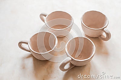 Handmade crafts clay pottery cups nude texture beige skin color bowl natural color eco friendly Stock Photo