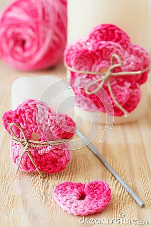 Handmade crochet pink flower on candle Stock Photo