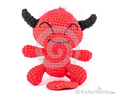 Handmade crochet red devil doll on white background Stock Photo