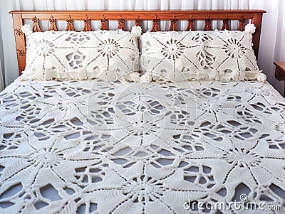 Handmade crochet white lace bedspread Stock Photo