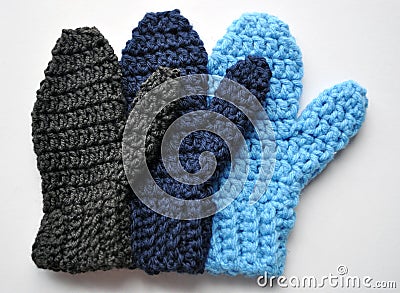 Handmade Crocheted Family of Mittens Stock Photo