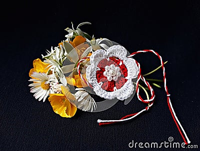 Handmade crocheted flower with red and white string, known as Martisor. Stock Photo