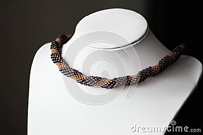 Handmade crocheted necklace made of beads of two colors Stock Photo