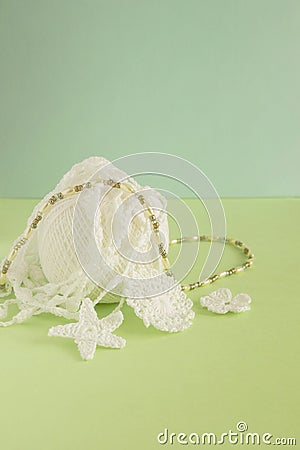 Handmade crocheted white cotton organic lace, crochet ball. Needlework creative craft, Tender Mori Girl lace style. Selective soft Stock Photo