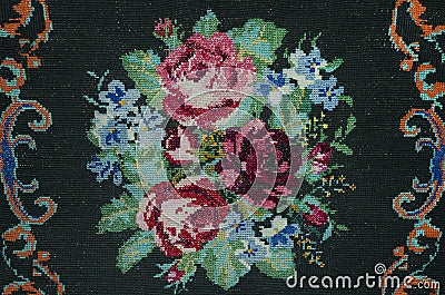 Handmade cross-stitch Bouquet of roses and cornflowers Stock Photo