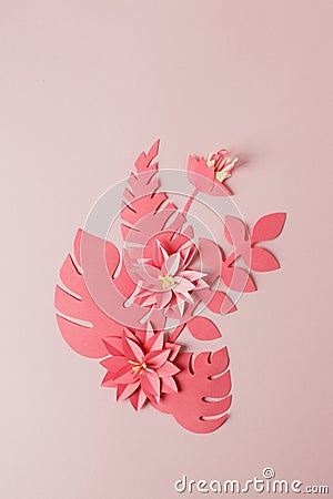 Handmade decorative paper pattern from tropical monochrome flower leaves on a pastel pink background with copy space. Top view. Stock Photo