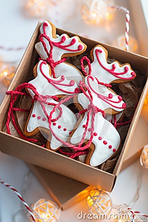 Handmade deer shaped gingerbread cookies in the carton box on the windowsill Stock Photo