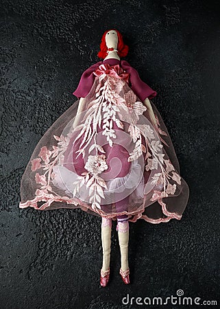 Handmade doll tilda in beautiful dress with red hair Stock Photo