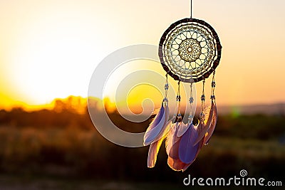 Handmade dream catcher with feathers threads and beads rope hanging Stock Photo